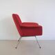 Red armchair with metal legs