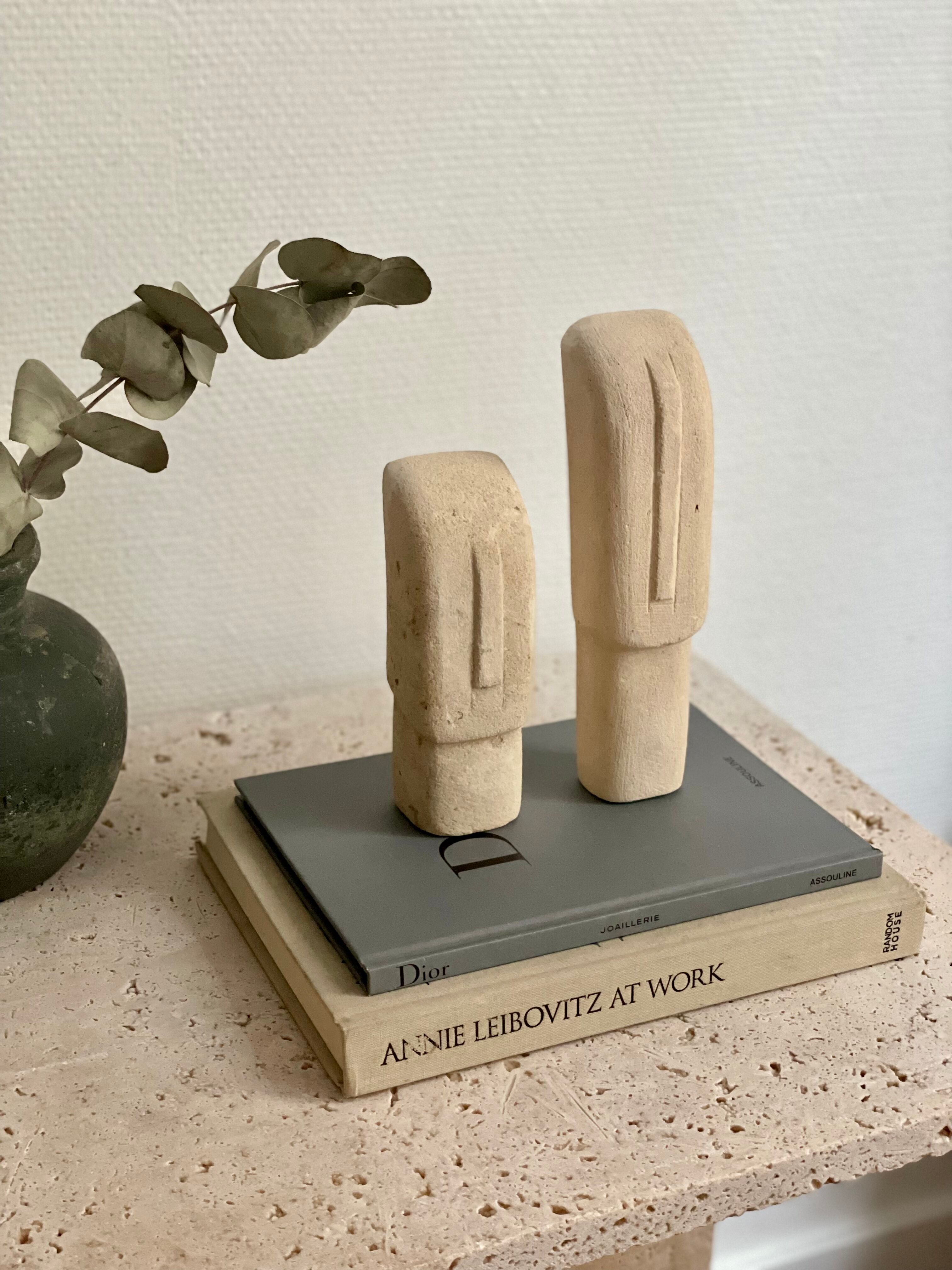 Set of two minimalist stone face statues