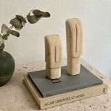 Set of two minimalist stone face statues