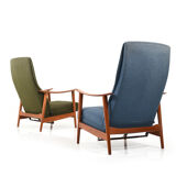 Pair of mid century Danish reclining lounge chairs in teak