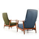 Pair of mid century Danish reclining lounge chairs in teak