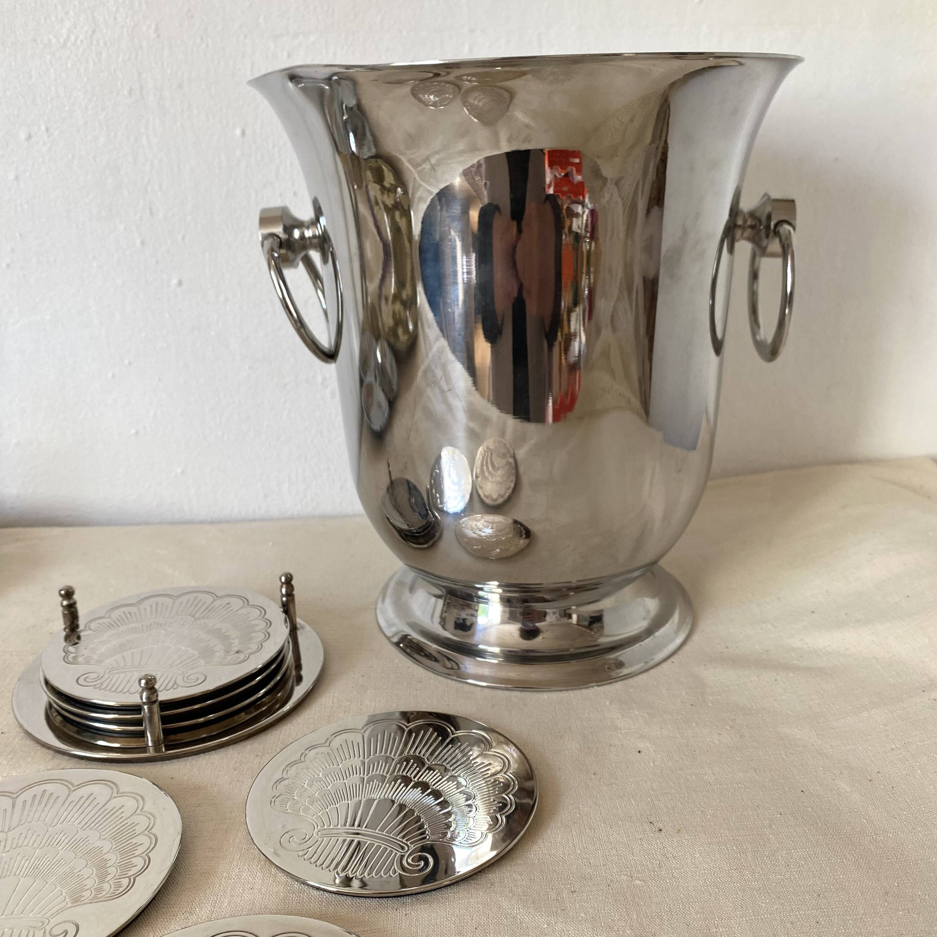 Silver coaster and holder, shell, 80s