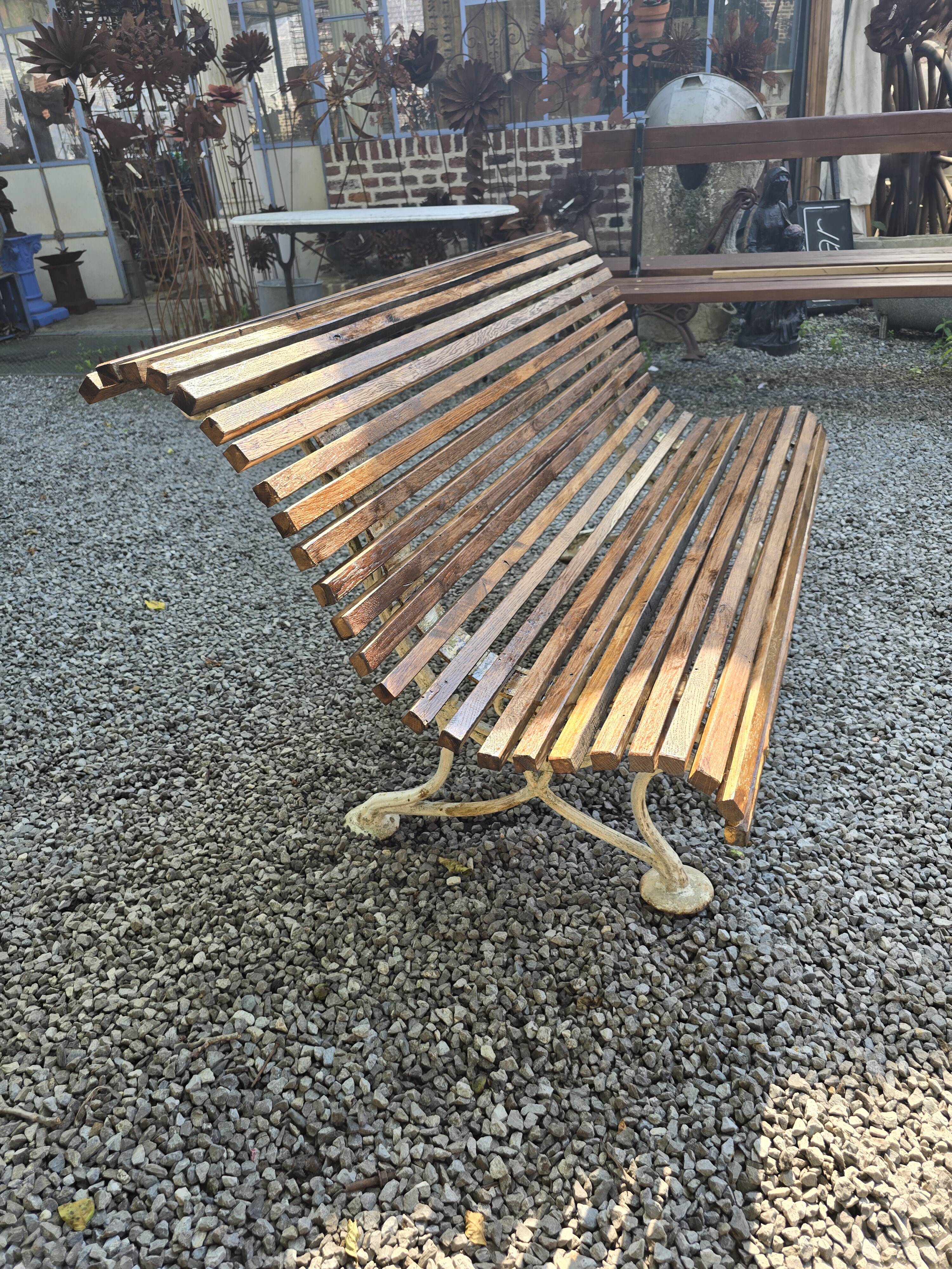 Garden bench with cast iron legs and oak slats