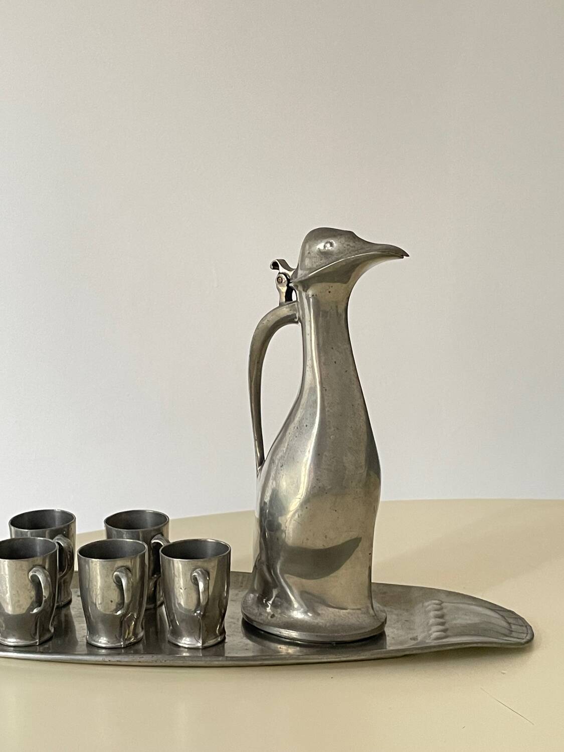 Polished pewter penguin-shaped carafe designed by Hugo Leven for Kayserzinn