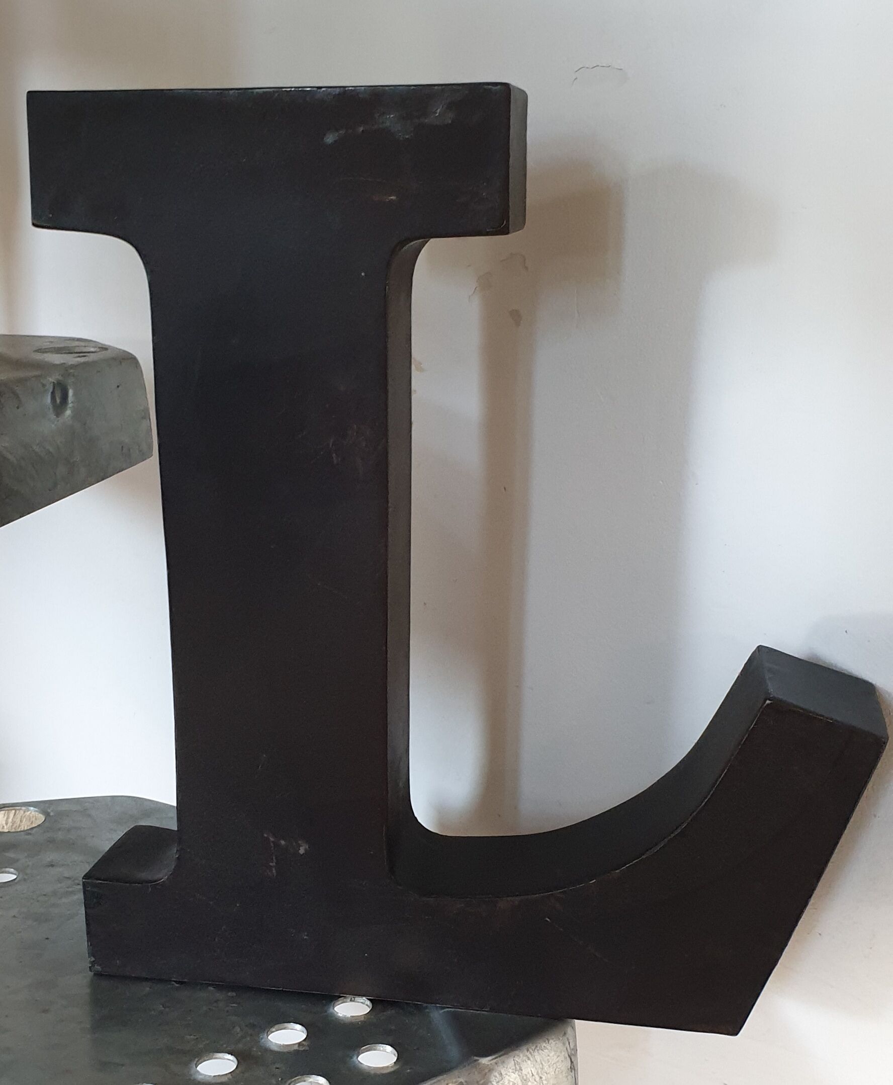 Letter l black metal
