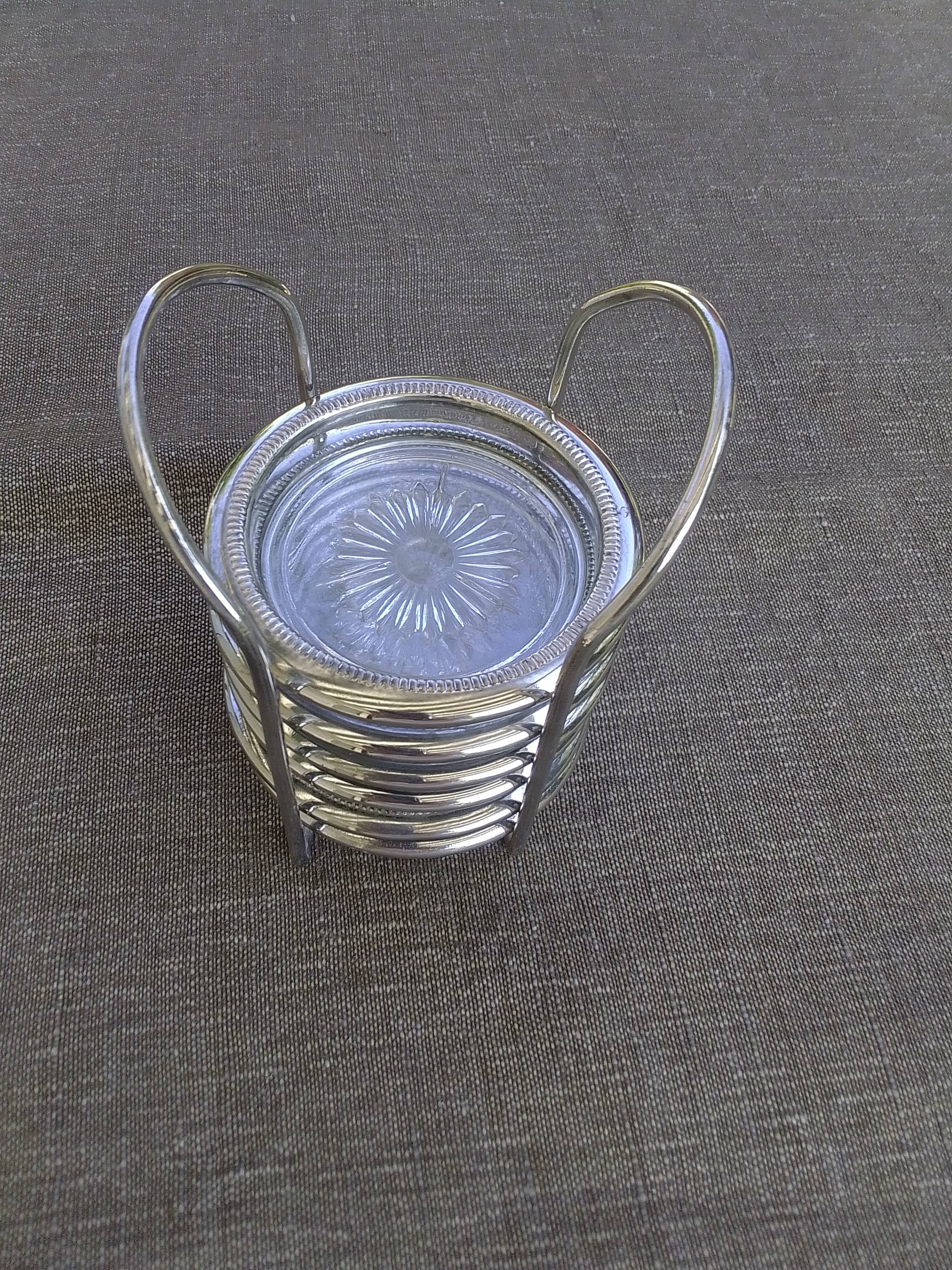 6 coasters and silver metal support