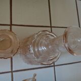 Carafe and bottle of pink glass and worked