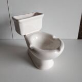 Atypical ashtray in the shape of a toilet