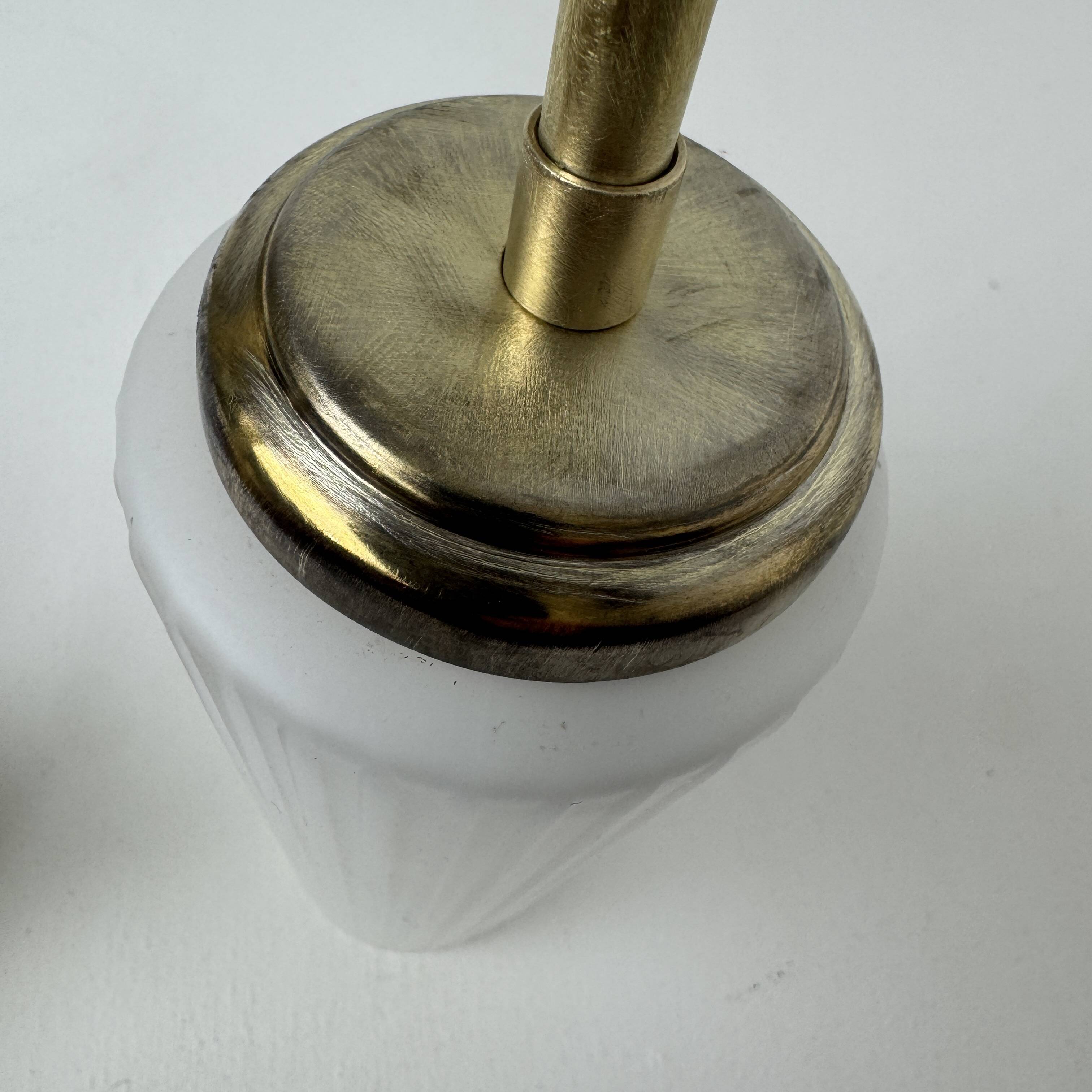 A pair of vintage opaline and brass wall lights