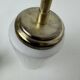 A pair of vintage opaline and brass wall lights