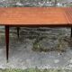 Table pieds effilés compas bois vernis extensible vintage années 50
