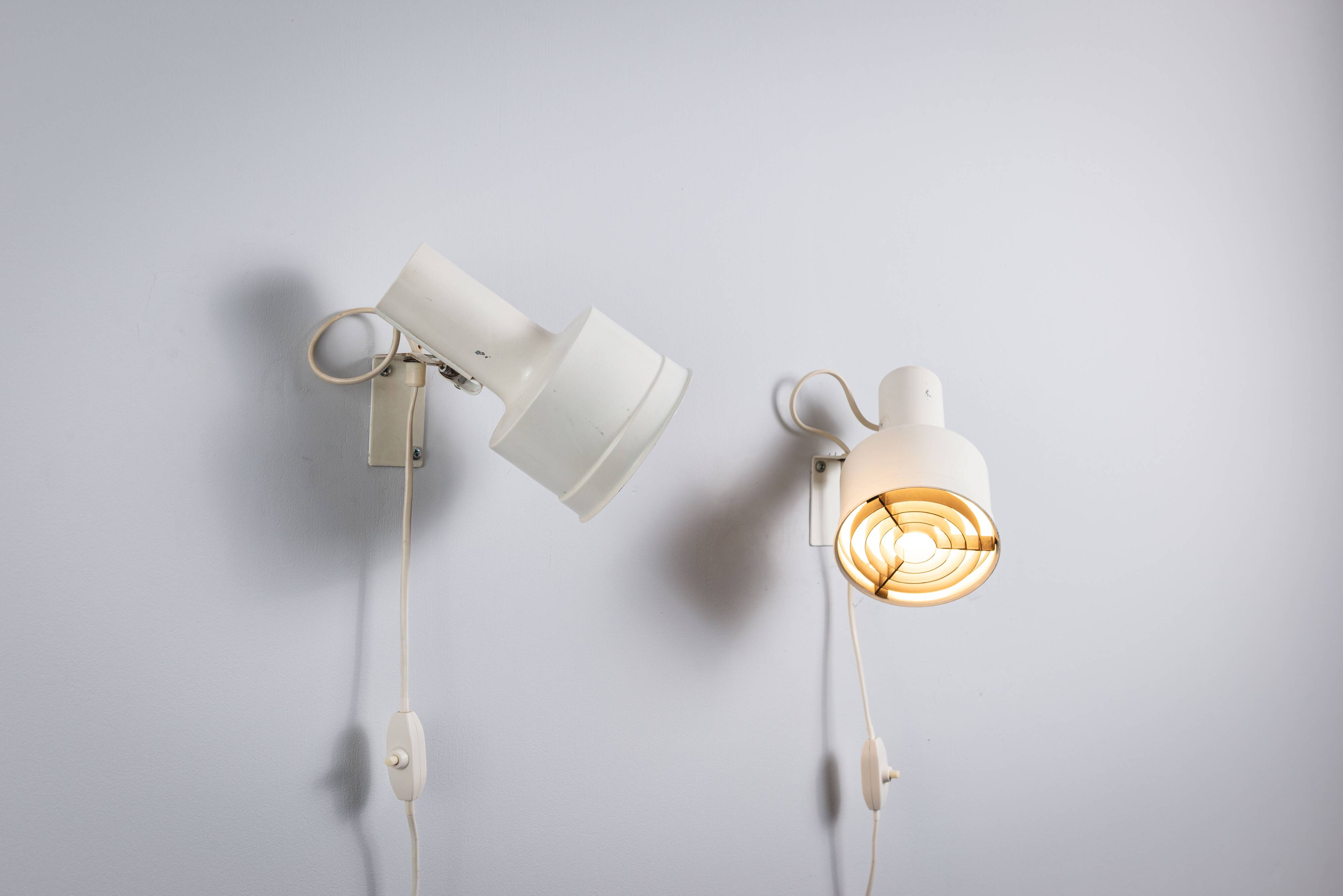 Pair of adjustable wall lamps designed by Per Sundstedt for Kosta Lampan