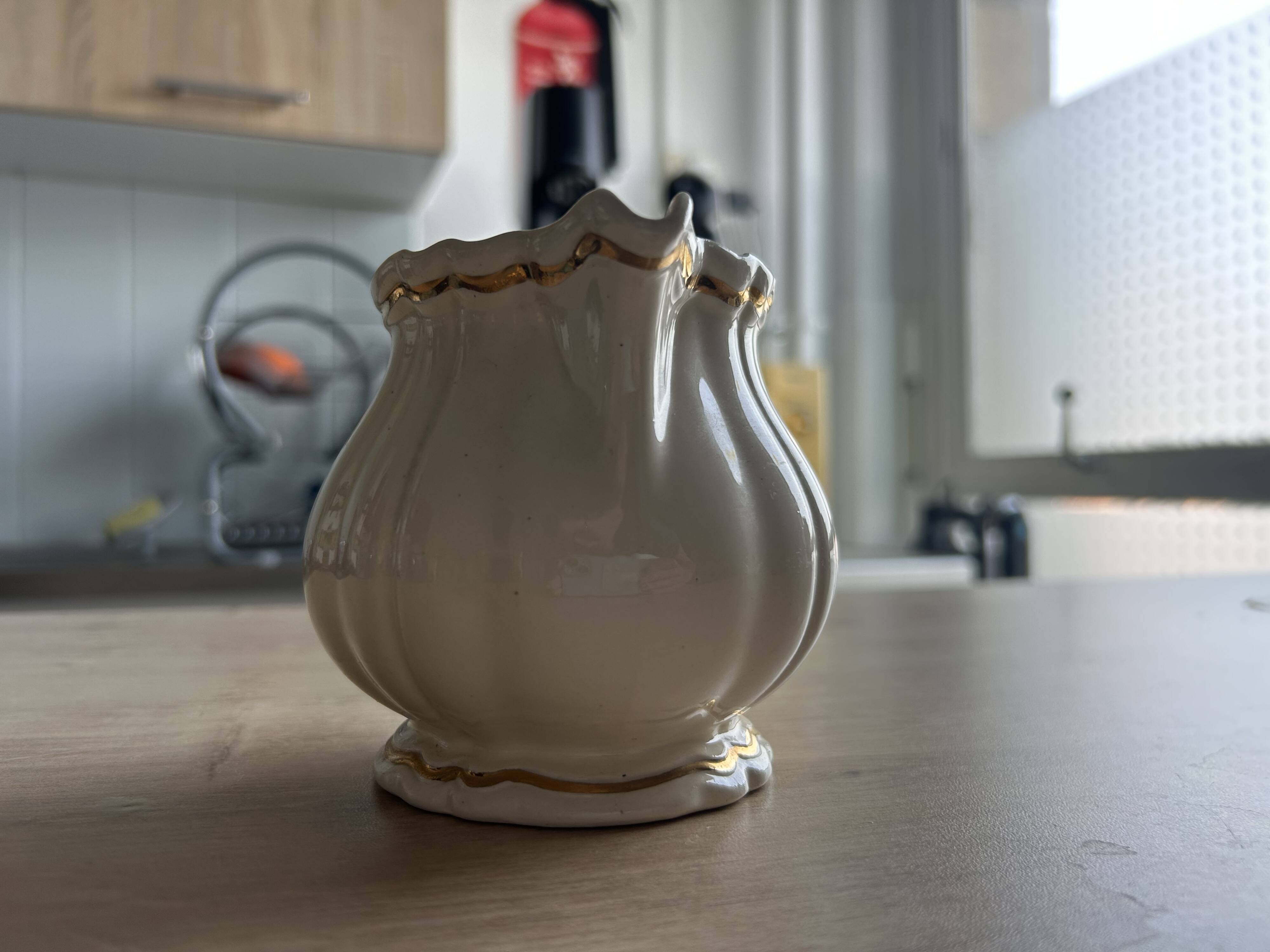 Old cream jug "Nous deux" in Sarreguemines earthenware.