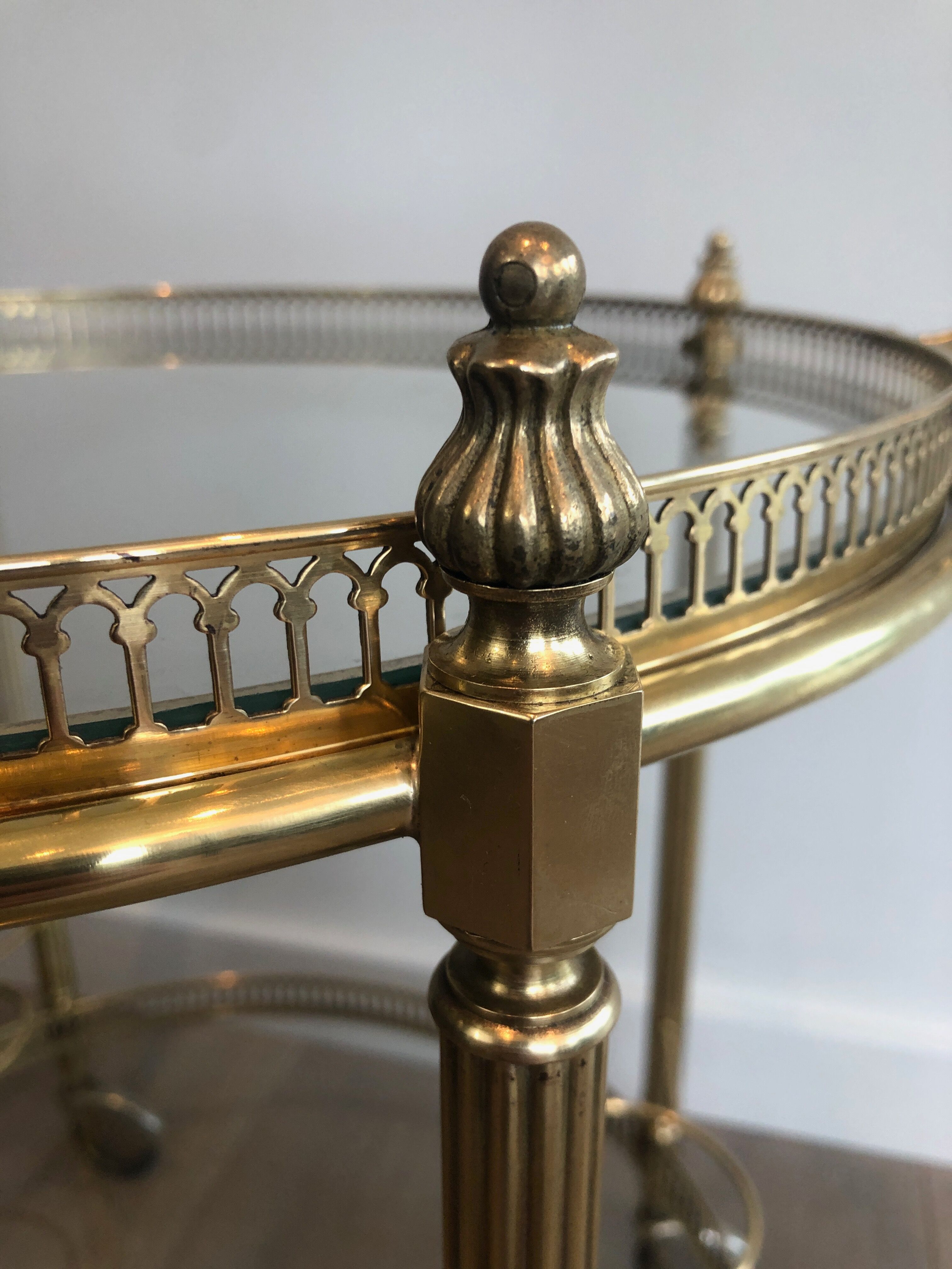 Neoclassical style rolling table in brass