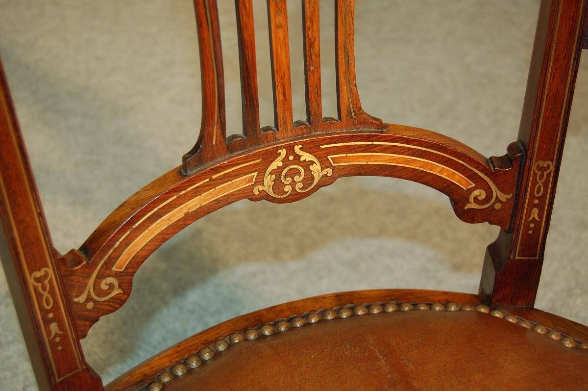 19th century armchair in leather and rosewood inlaid with brass and rosewood
