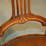 19th century armchair in leather and rosewood inlaid with brass and rosewood