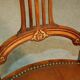 19th century armchair in leather and rosewood inlaid with brass and rosewood