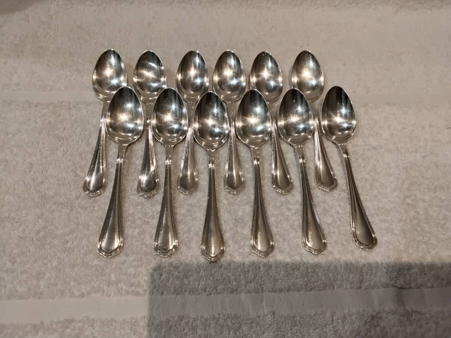 12 Christofle silver plated dessert spoons, 17cm