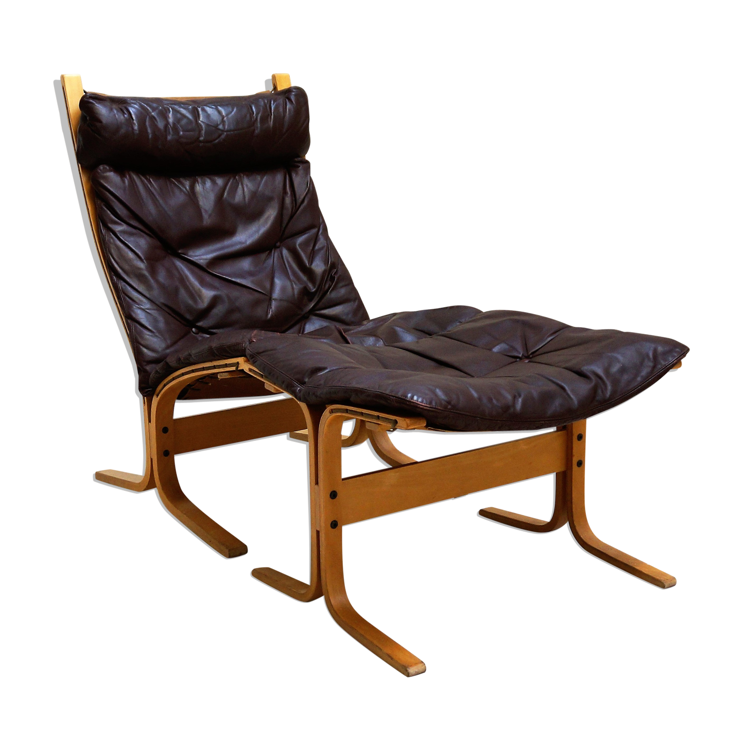 Fauteuil Siesta en cuir marron et son ottoman