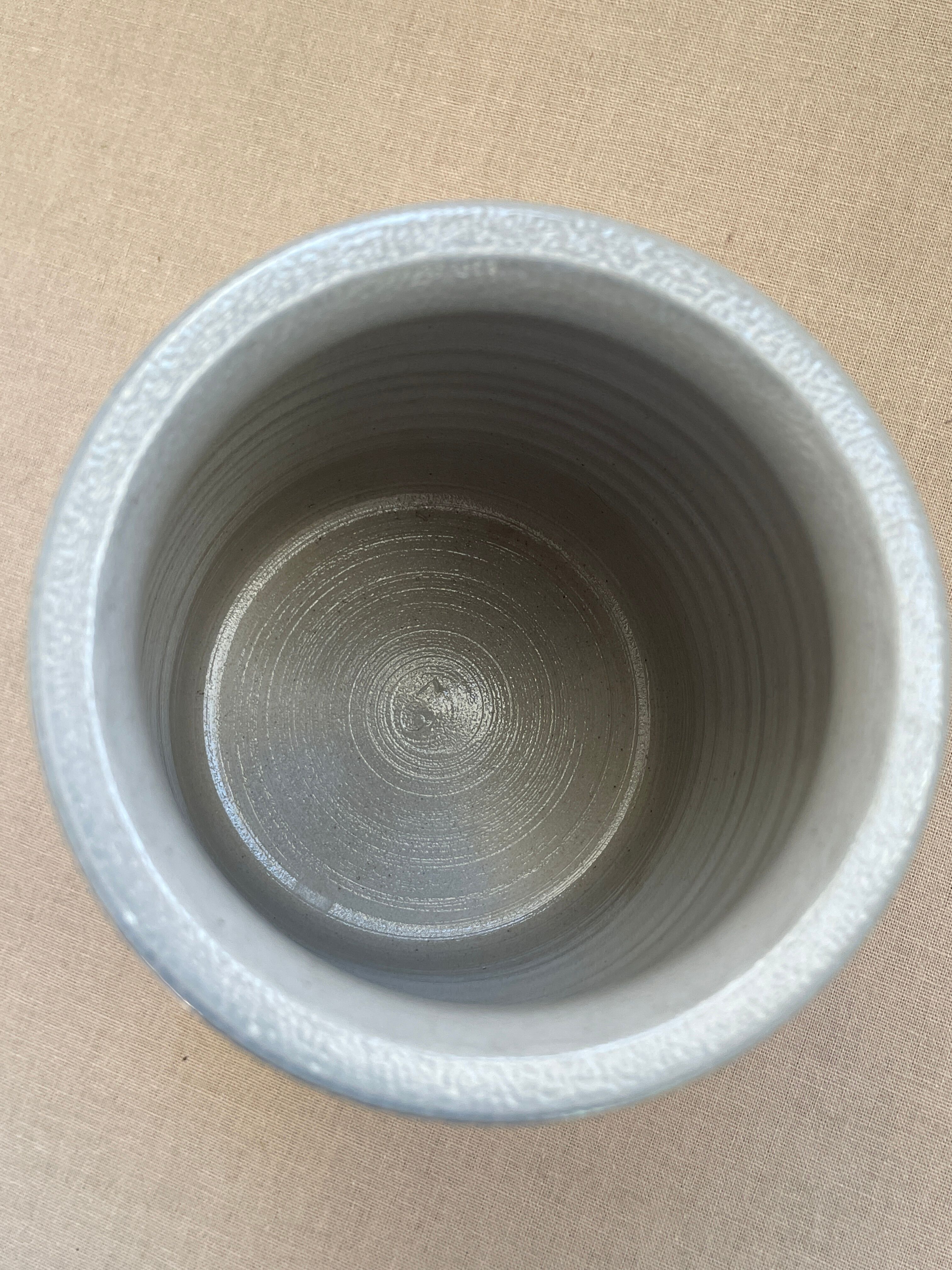 Vintage stoneware pot from Betschdorf signed TA Gilbert with olive decoration.