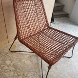 Modernist armchair in woven leather and black metal – 1960s–1970s