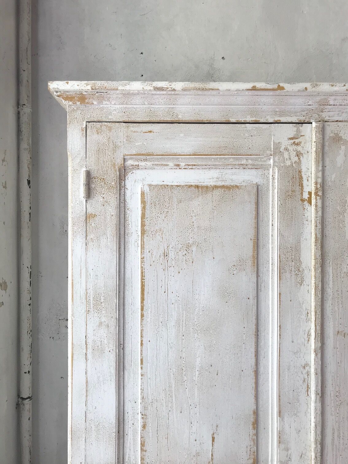 Antique wardrobe in patinated pine