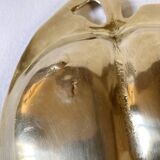 Brass catchall in the shape of an apple.