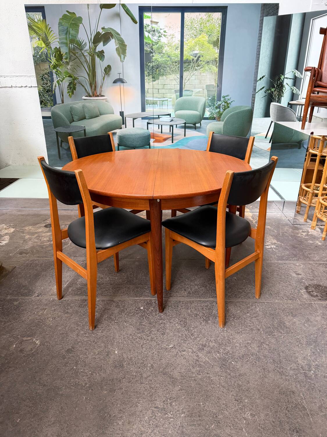 4 Scandinavian chairs in teak and black faux leather.