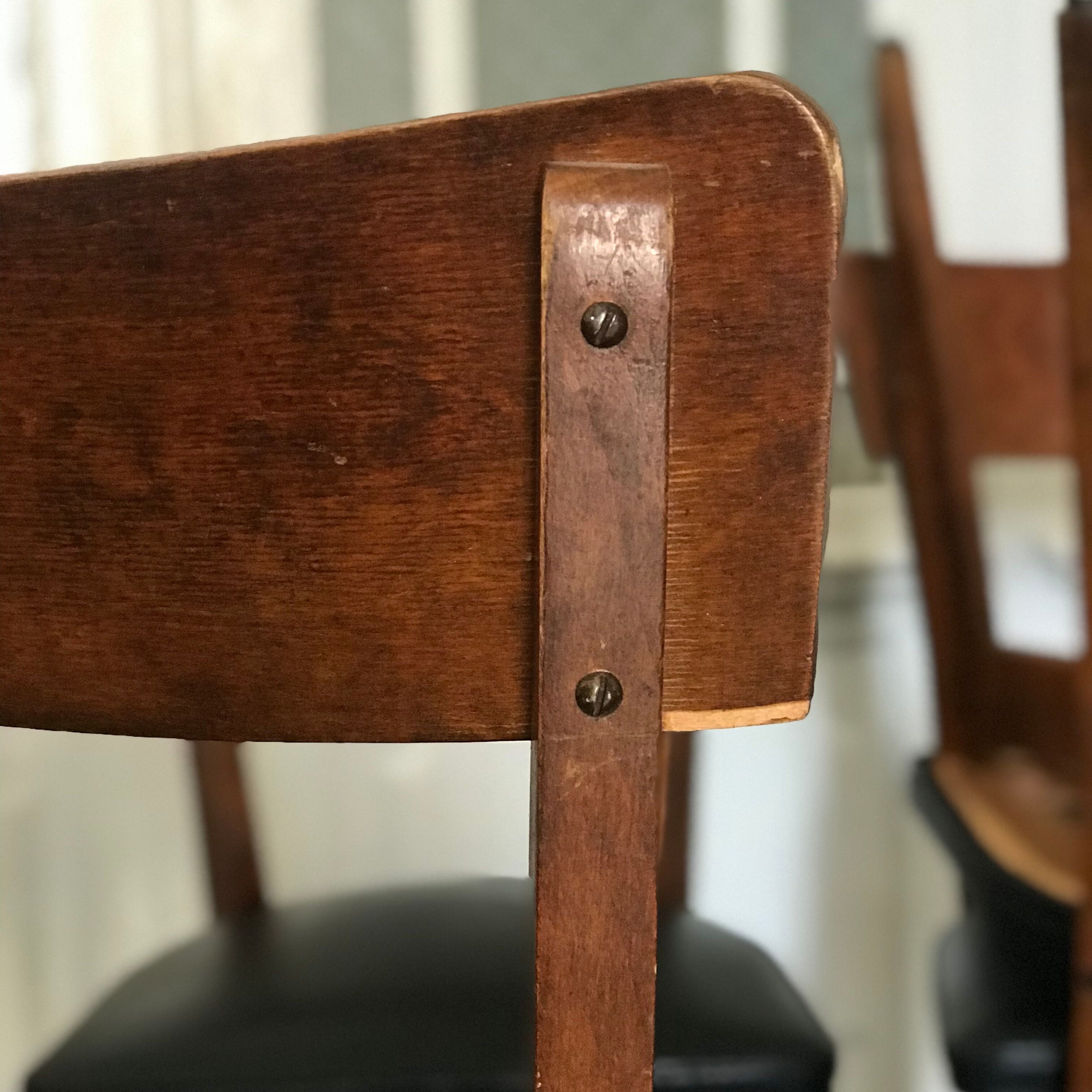 Vintage wooden and black skai chairs