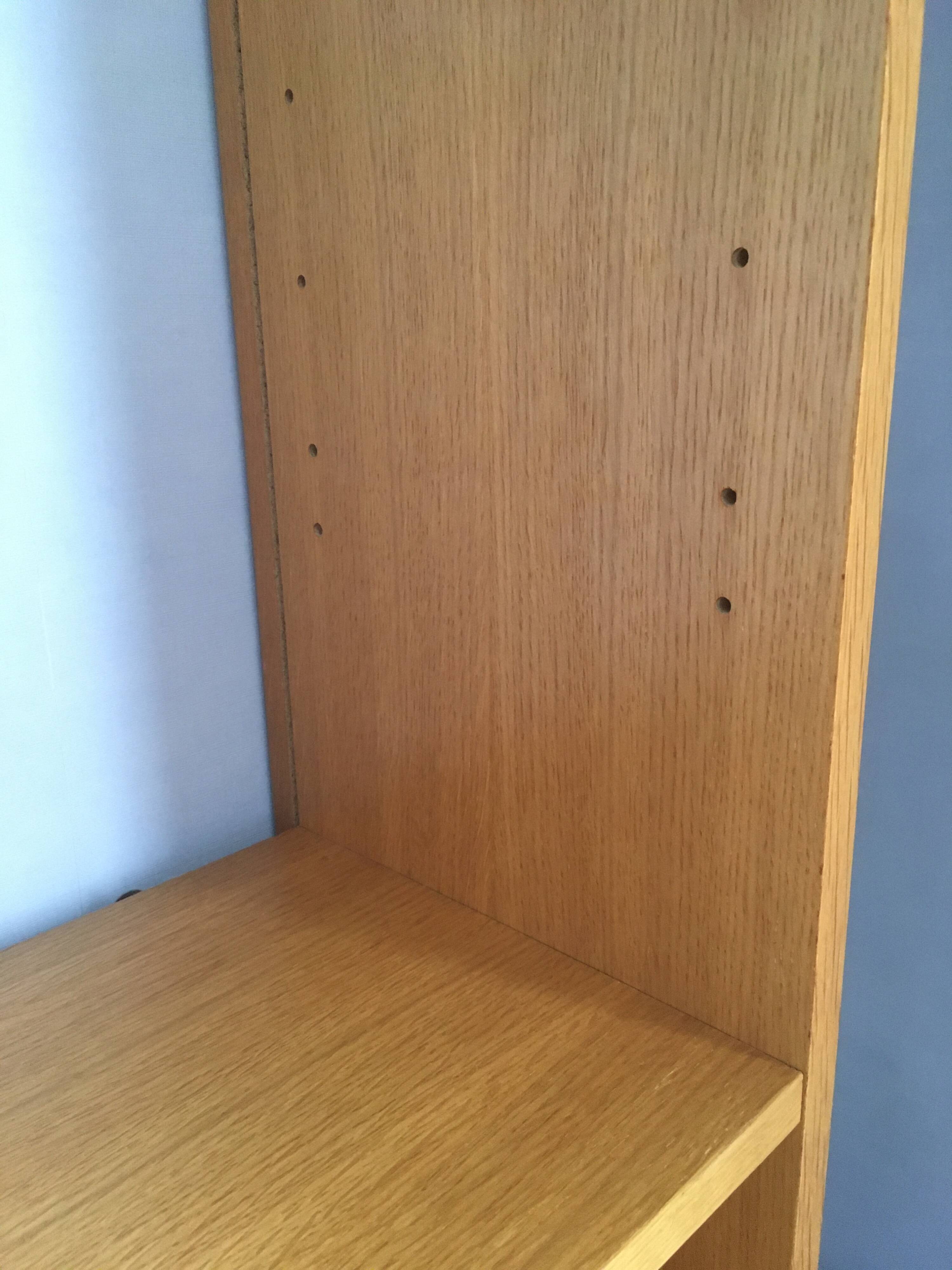 Dressing vintage Scandinavian style in light wood with wardrobe and cupboard.