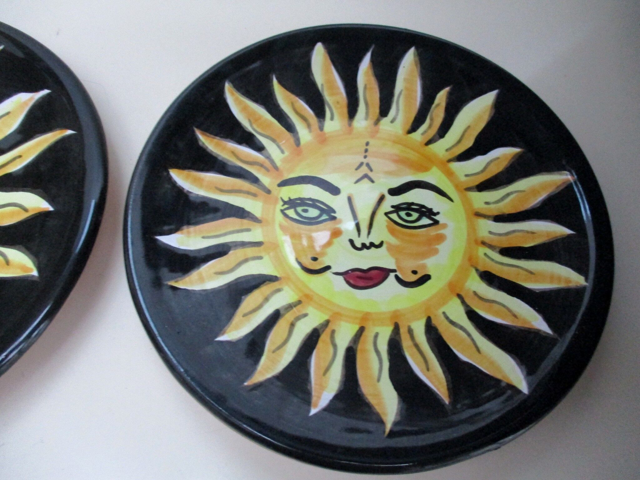 2 hand-decorated ceramic plates