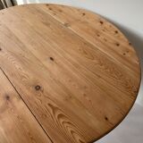 Round wooden table with flaps