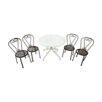 Garden furniture, White round wrought iron table. and 4 heavy steel chairs, original black