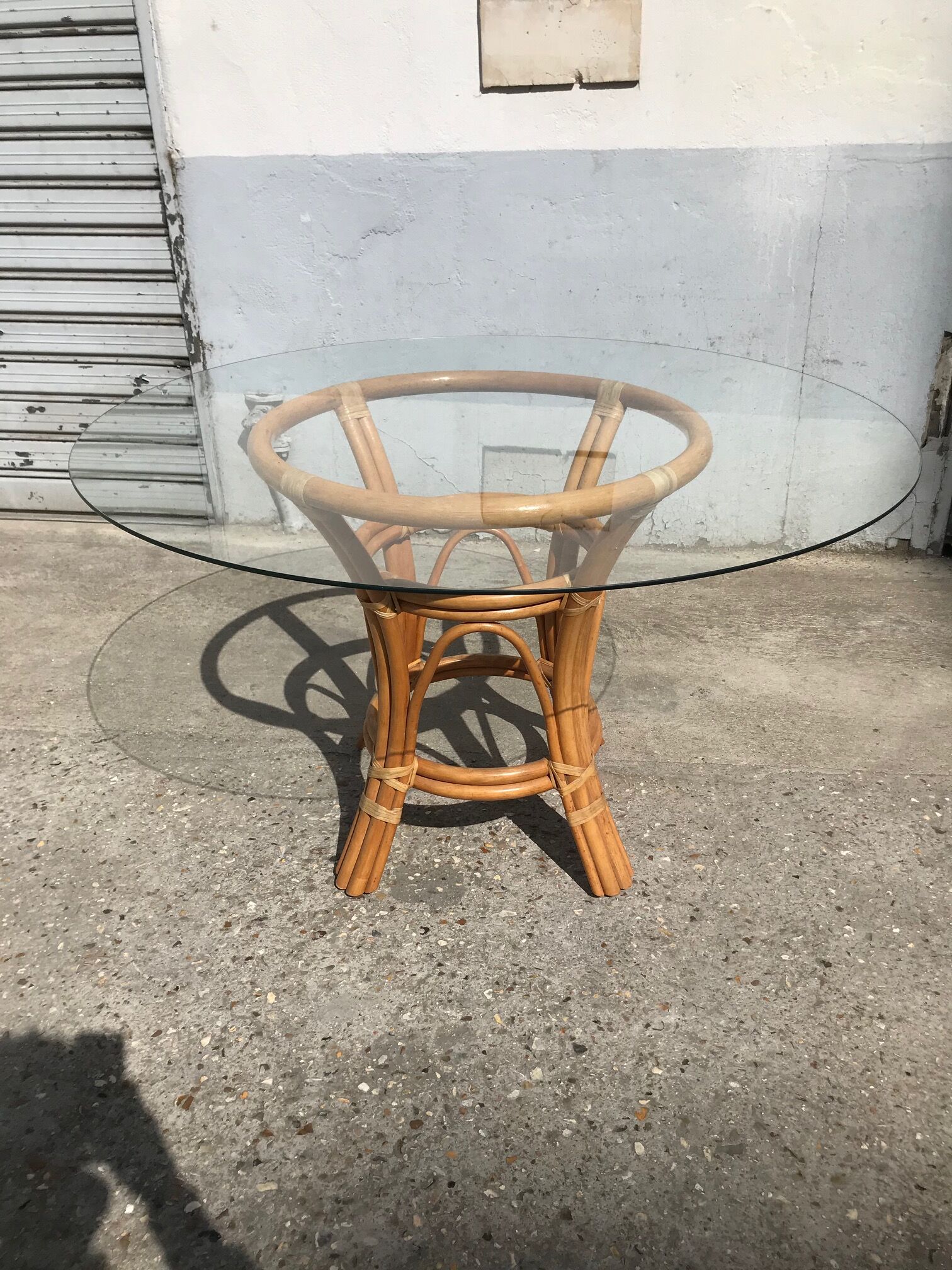 Rattan and glass dining table
