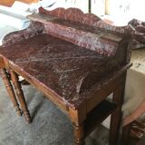 Toilet table on red marble
