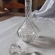 Cut crystal oil bottle with its crystal stopper.