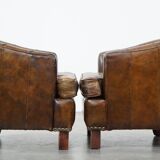 Set of 2 sturdy design armchairs made of cowhide with a beautiful deep color