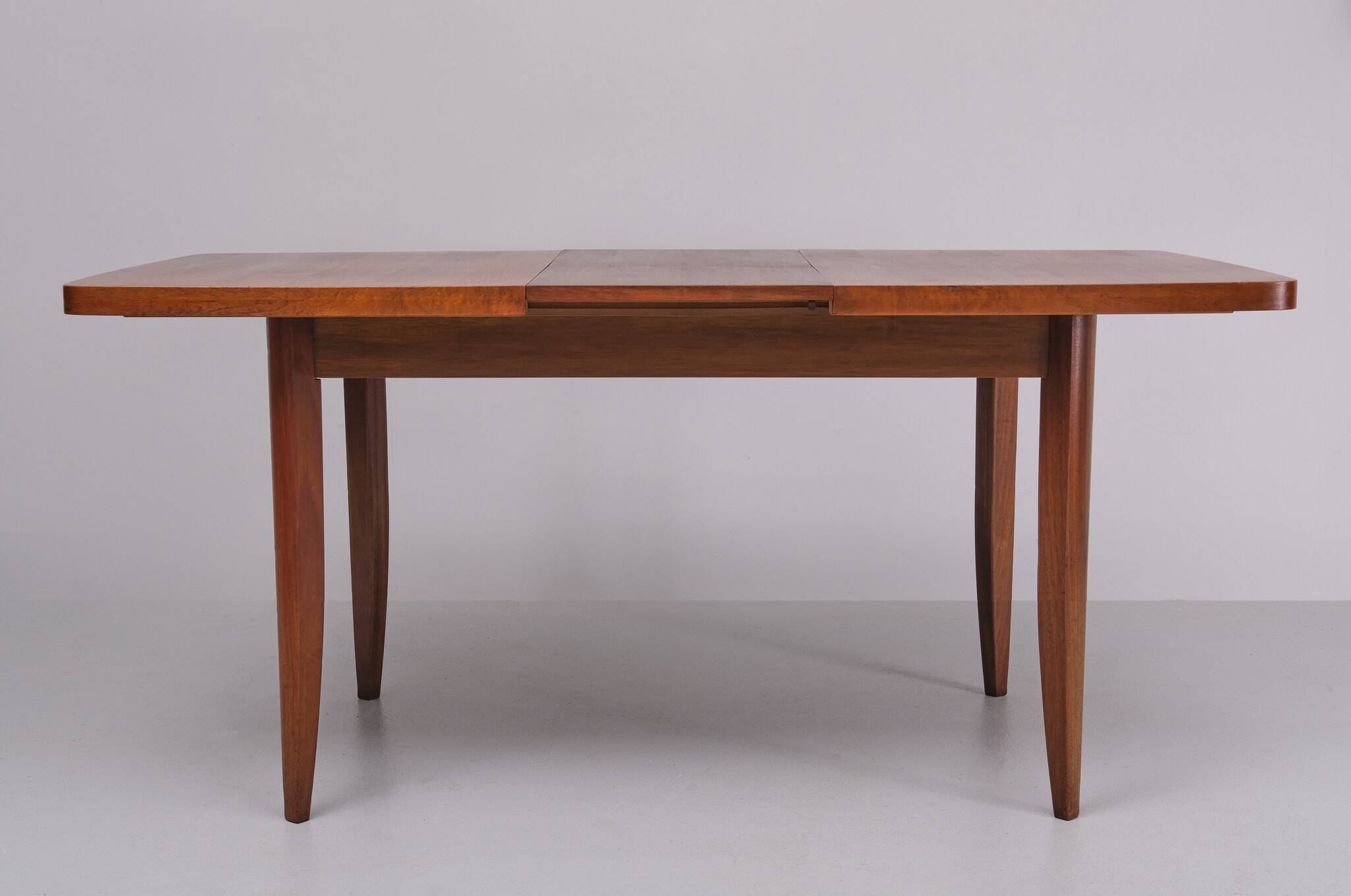 Extendable dining table in walnut wood by Jindrich Halabala 1960