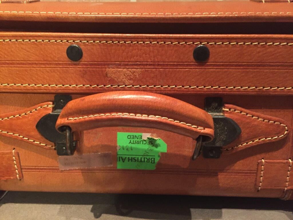 Thick leather suitcase