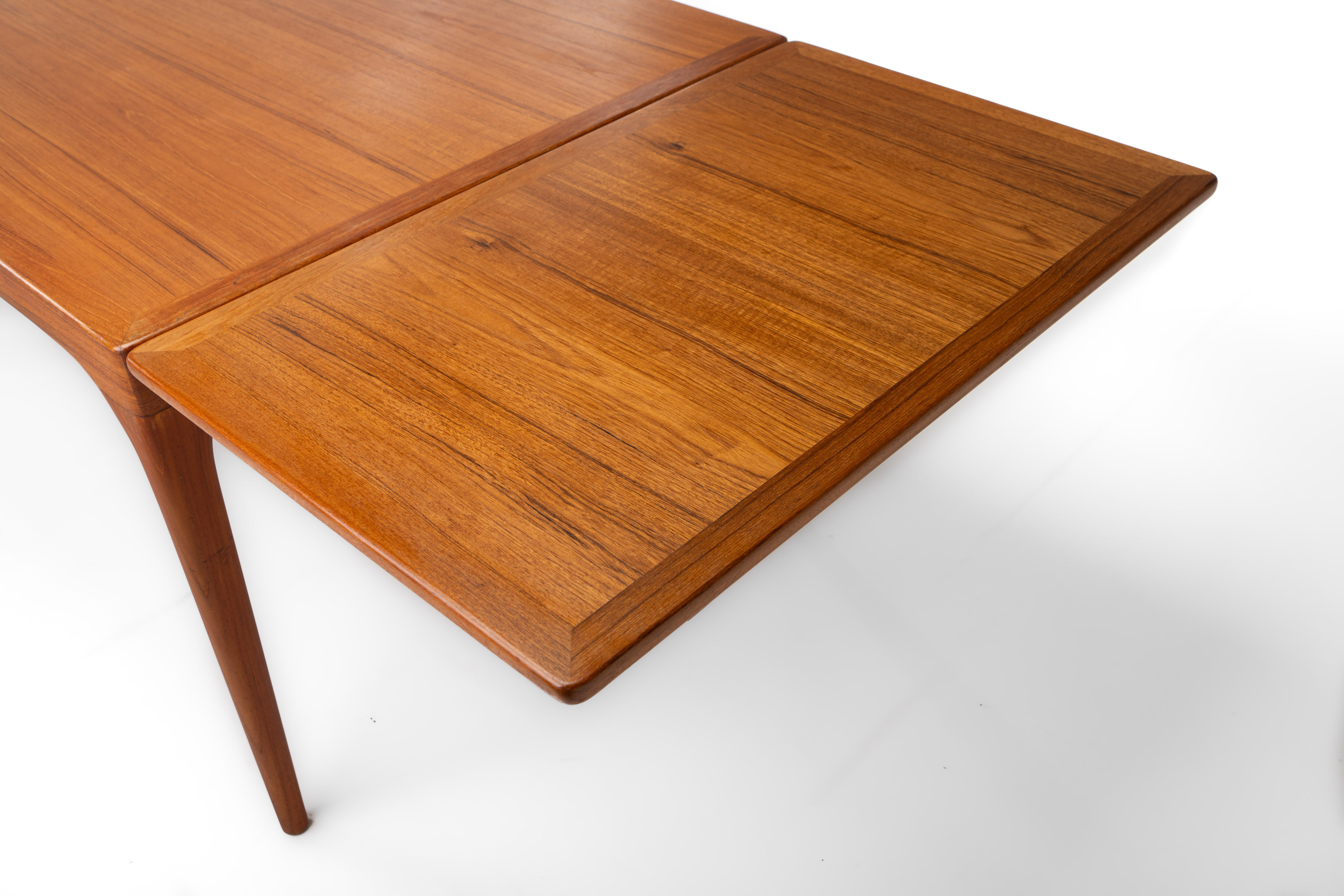 Extendable dining table in teak by Johannes Andersen for Uldum Møbelfabrik