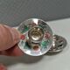 Silver-plated candle holders with inlaid red and green enamel