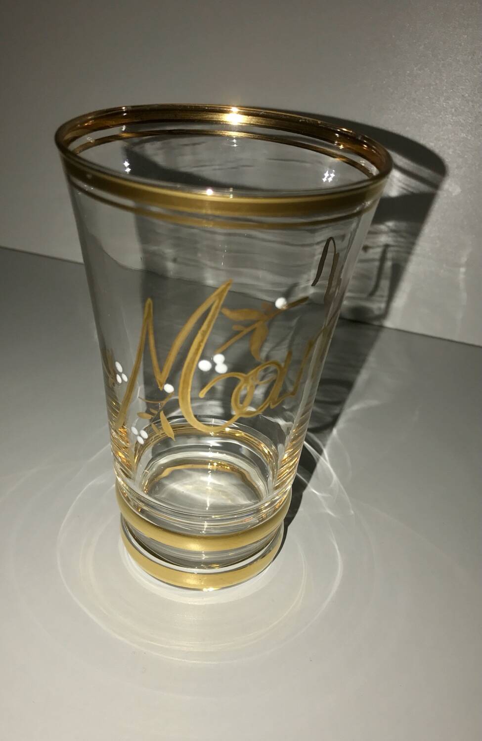 Antique gilded glass with the inscription Maman