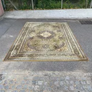 Large Persian wool rug 250x350 cm in gold and navy blue.