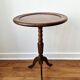 Small tripod wooden table with a vintage round top -
