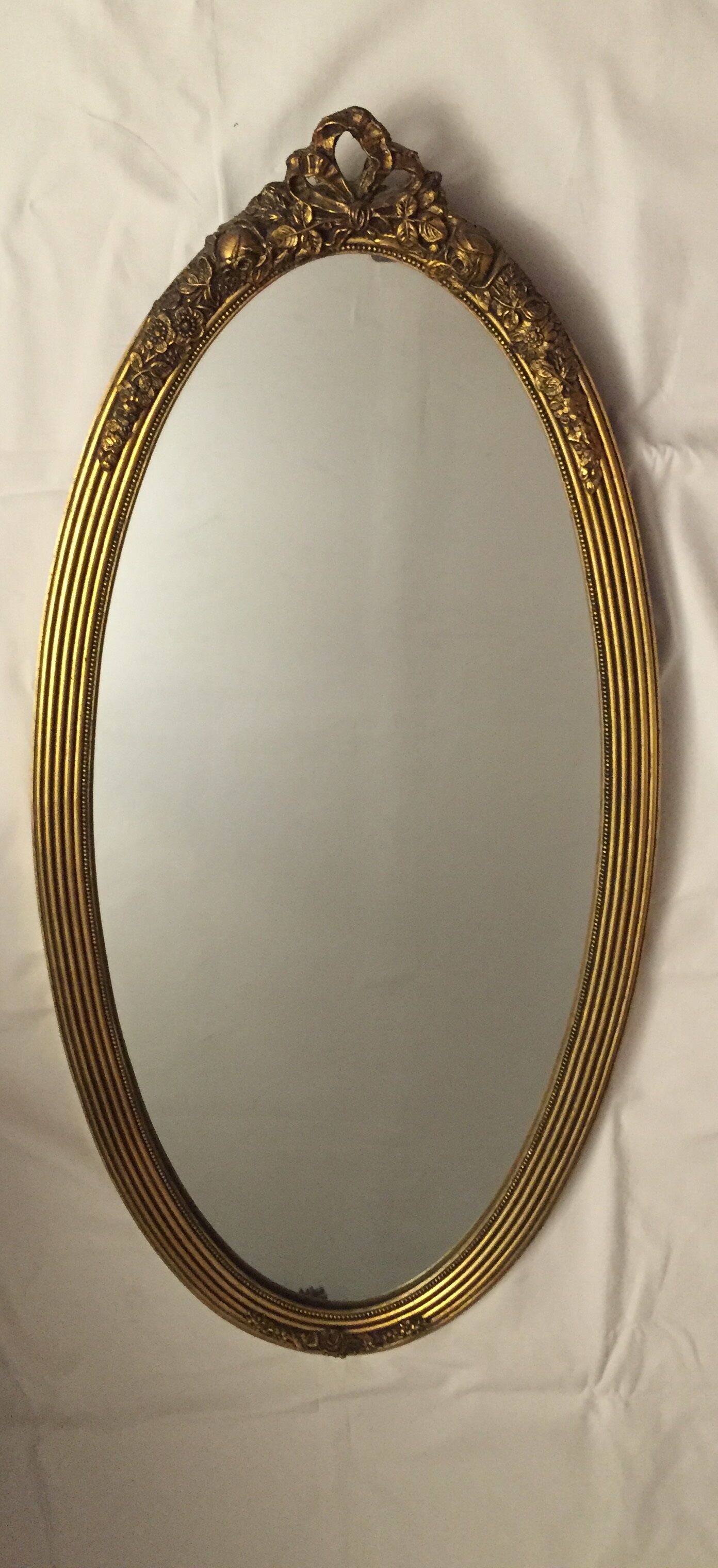 Miroir ovale en bois doré 85x43 cm