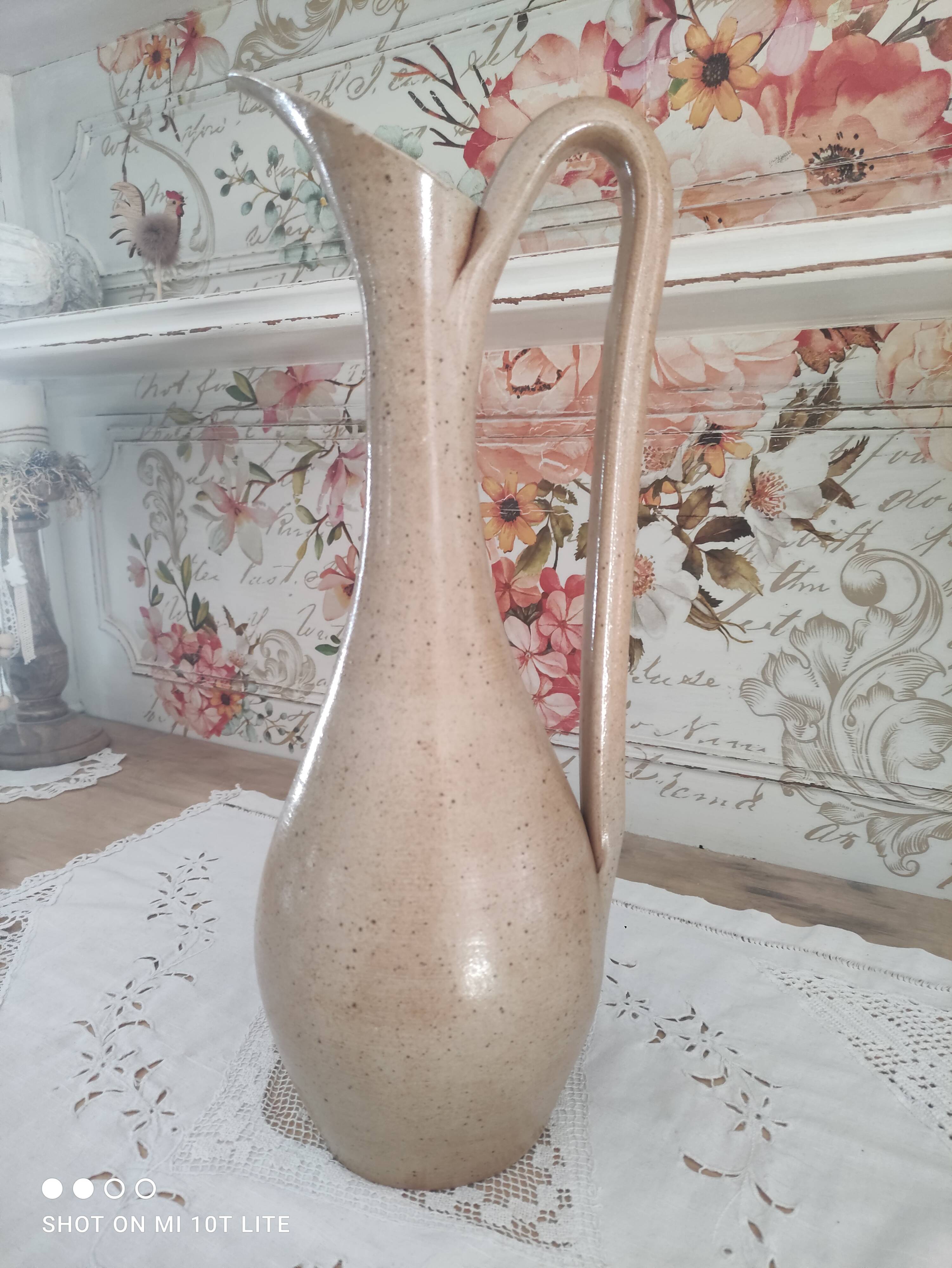 Vintage pitcher in light brown sandstone speckled
