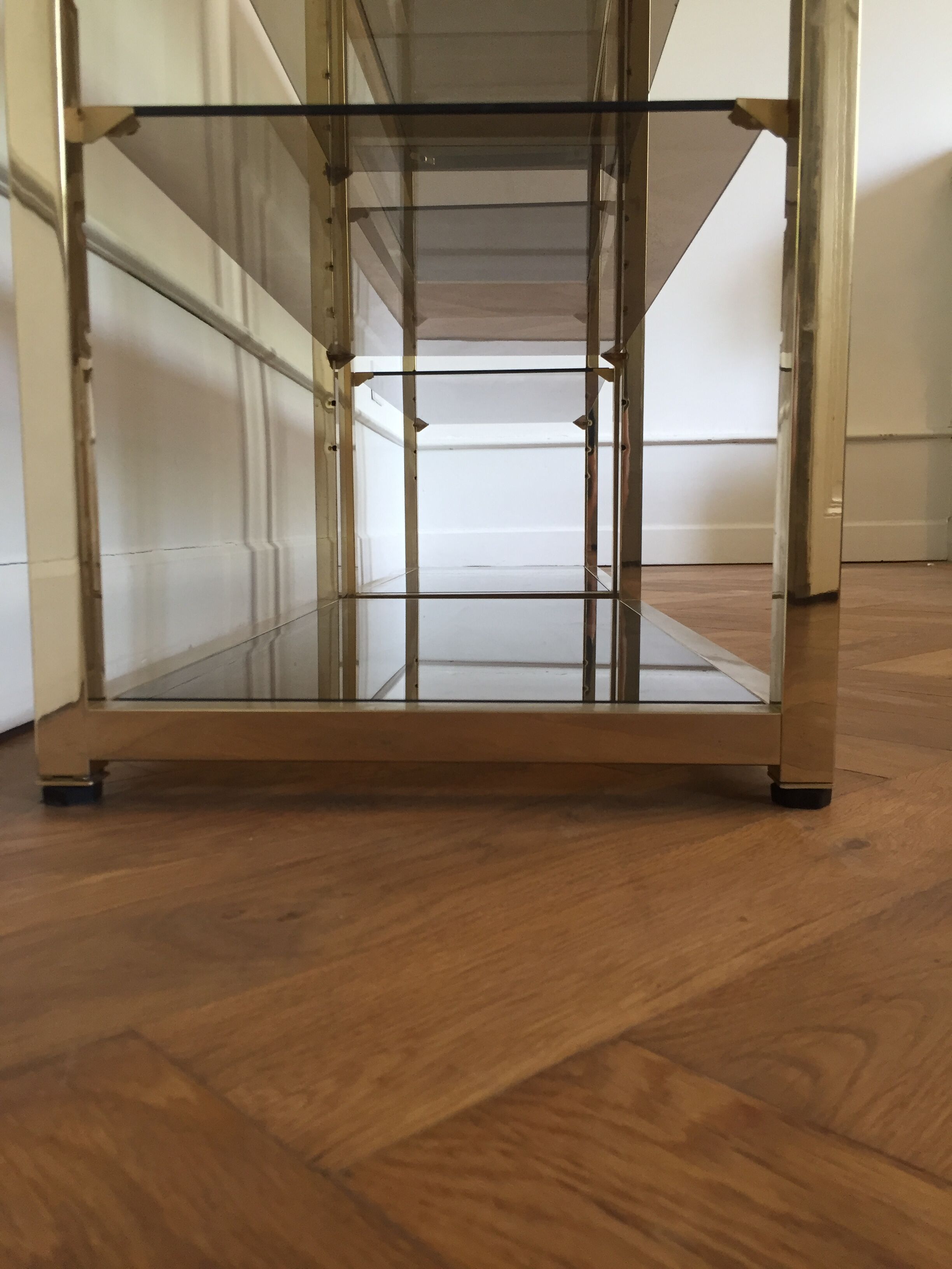 Pair of consoles brass shelves and smoked glass design Roche Bobois