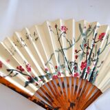 Vintage bamboo fan with floral decoration from China.
