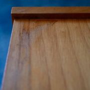 Rockabilly design bedside table with tapered legs.
