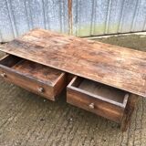 Old coffee table from the Guérandais region in solid oak with 2 front drawers